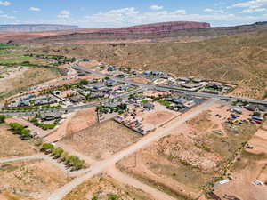 Birds eye view of property featuring view of desert and a mountain view