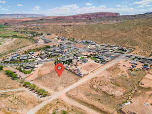 Birds eye view of property with view of desert and a mountain view