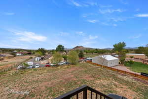 View of yard with fence and a mountain view