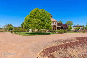 Exterior space featuring fence and a yard