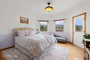 Bedroom featuring baseboards and light wood finished floors