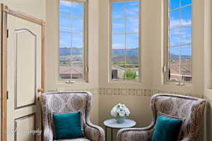 Primary Bedroom sitting area with a mountain view and a wealth of natural light