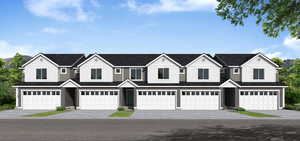 View of property with driveway and a garage