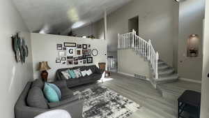 Front Room. Vaulted Ceilings. Stairs with Upper Level Landing. Decorative alcove.