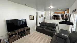 Living Room. High Ceilings. Natural Lighting. View of Dining Area.