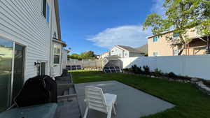 Rear View. Shed. Flower Beds. Concrete patio. Solar.