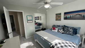 #2 Upstairs Bedroom. Natural Lighting. Ceiling Fan. Sliding Mirror Closet Doors.