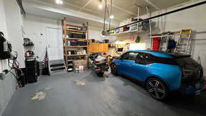 Garage. High Ceilings. Storage Shelves. 240 Volt Electric Vehicle fast charger.