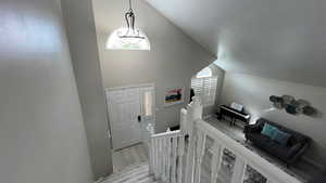 Upper Landing View. Natural Lighting. Vaulted Ceilings.