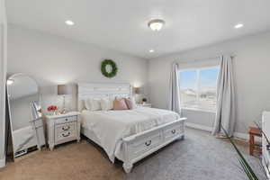 Bedroom with recessed lighting, baseboards, and light colored carpet