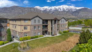 View of property with a mountain view