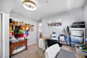 Office area featuring baseboards