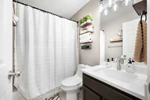 Full bath with vanity and toilet