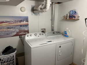 Lower Area Room 5: Laundry area with laundry area and washing machine and clothes dryer