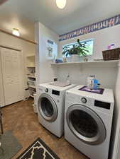 Laundry room with independent washer and dryer and laundry area