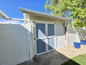 View of shed with fence