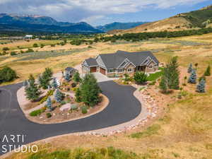 Birds eye view of property with a mountain view