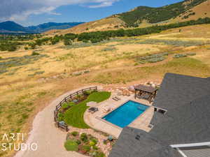 View of pool featuring a mountain view, a pergola, and a patio