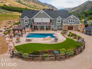 View of swimming pool with a mountain view, a yard, a patio area, and a gazebo