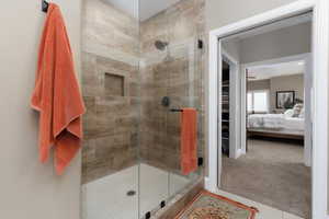 Bathroom with a shower with shower door