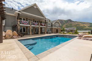 View of swimming pool featuring a mountain view and a patio area