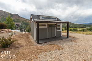 View of outdoor structure featuring a mountain view