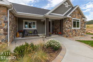 Entrance to property featuring a porch