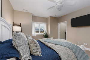 Bedroom featuring ceiling fan and carpet flooring