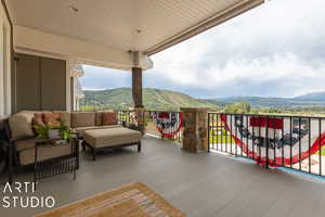 Wooden terrace with a mountain view and outdoor lounge area