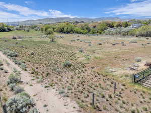 Property view of mountains featuring a rural view