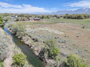 Birds eye view of property featuring a rural view and a mountain view