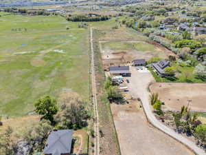 Birds eye view of property featuring a rural view