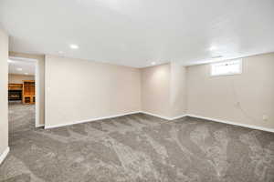 Basement featuring recessed lighting, carpet, and baseboards