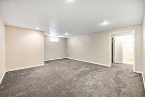 Basement with carpet floors, baseboards, and recessed lighting