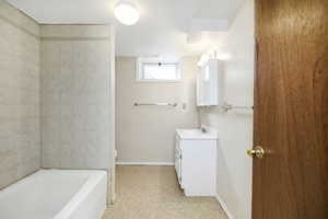 Full bathroom featuring vanity, visible vents, toilet, baseboards, and tile patterned floors
