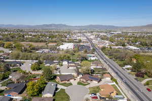 Birds eye view of property with a mountain view and a residential view