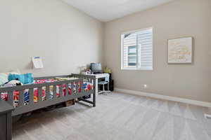 Bedroom featuring baseboards, carpet flooring, and visible vents