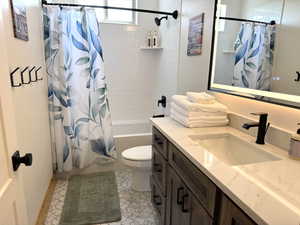 Upstairs full bath with vanity and shower / tub combo.