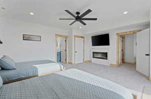 Dowstairs master bedroom with ensuite bath, 2 queen beds and an electric fireplace