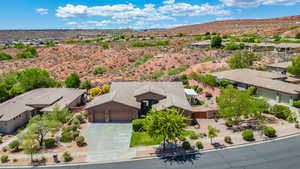 Birds eye view of property with a residential view, a mountain view, and a desert view