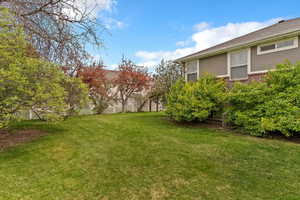 View of yard featuring fence