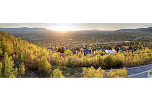 Property view of mountains with a residential view