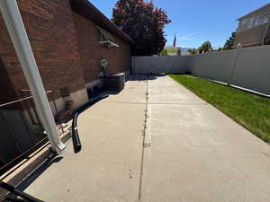 View of patio / terrace featuring a fenced backyard and central air condition unit