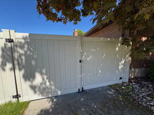 View of gate featuring fence