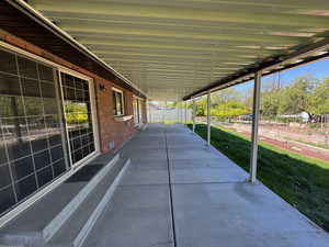 View of patio with fence