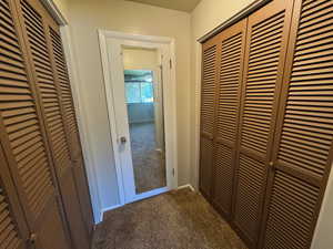 Hallway with carpet flooring