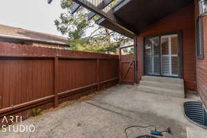 View of patio / terrace featuring a gate, fence, and entry steps