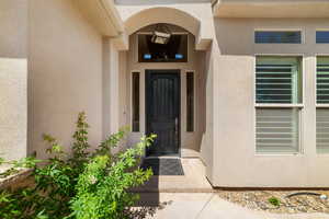 Property entrance with stucco siding