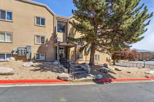 View of front of property featuring stucco siding