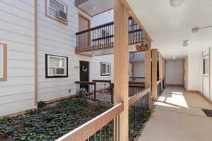 Doorway to property with a balcony